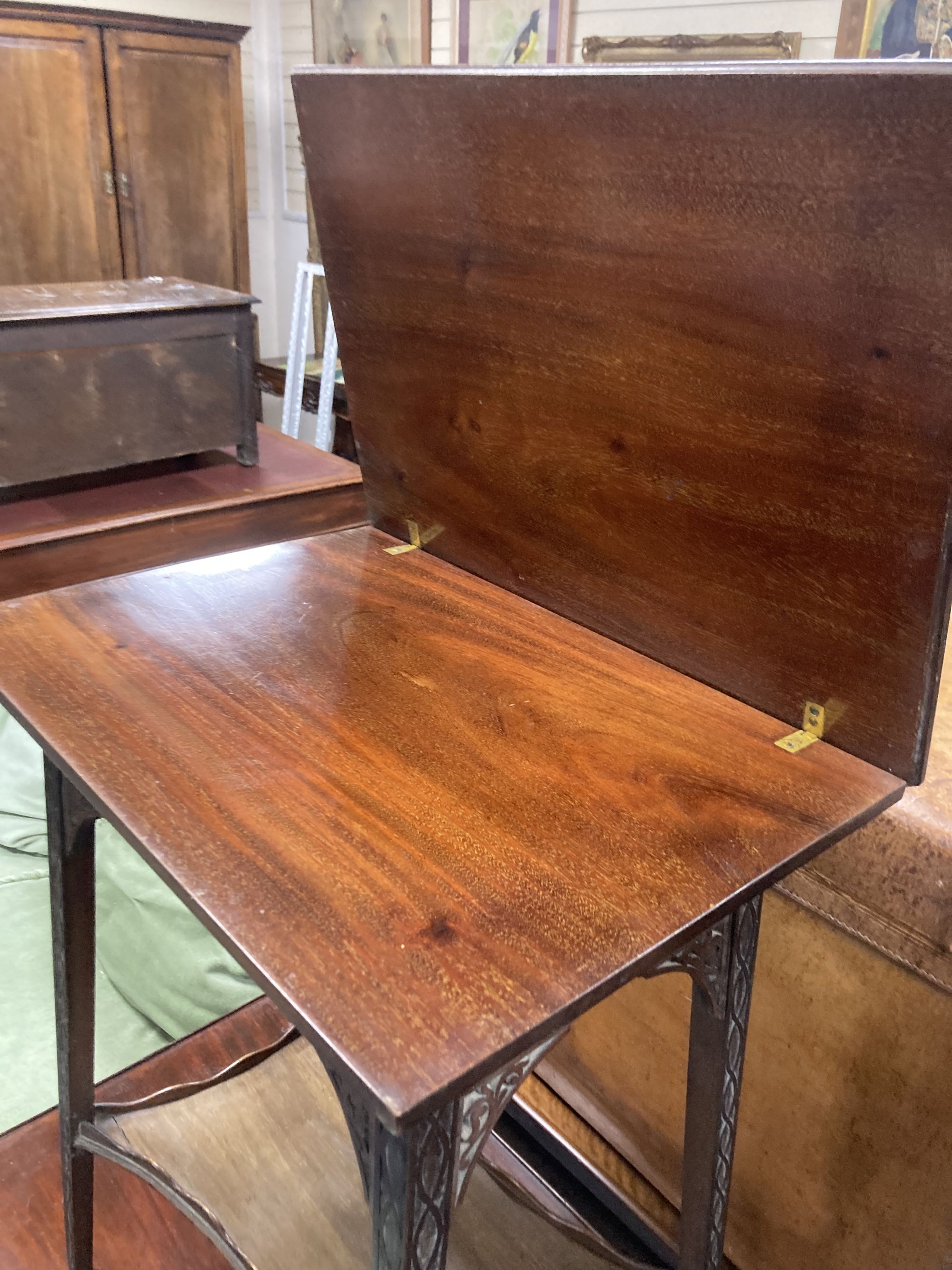 An Edwardian mahogany blind fret folding tea table, width 52cm, depth 37cm, height 69cm